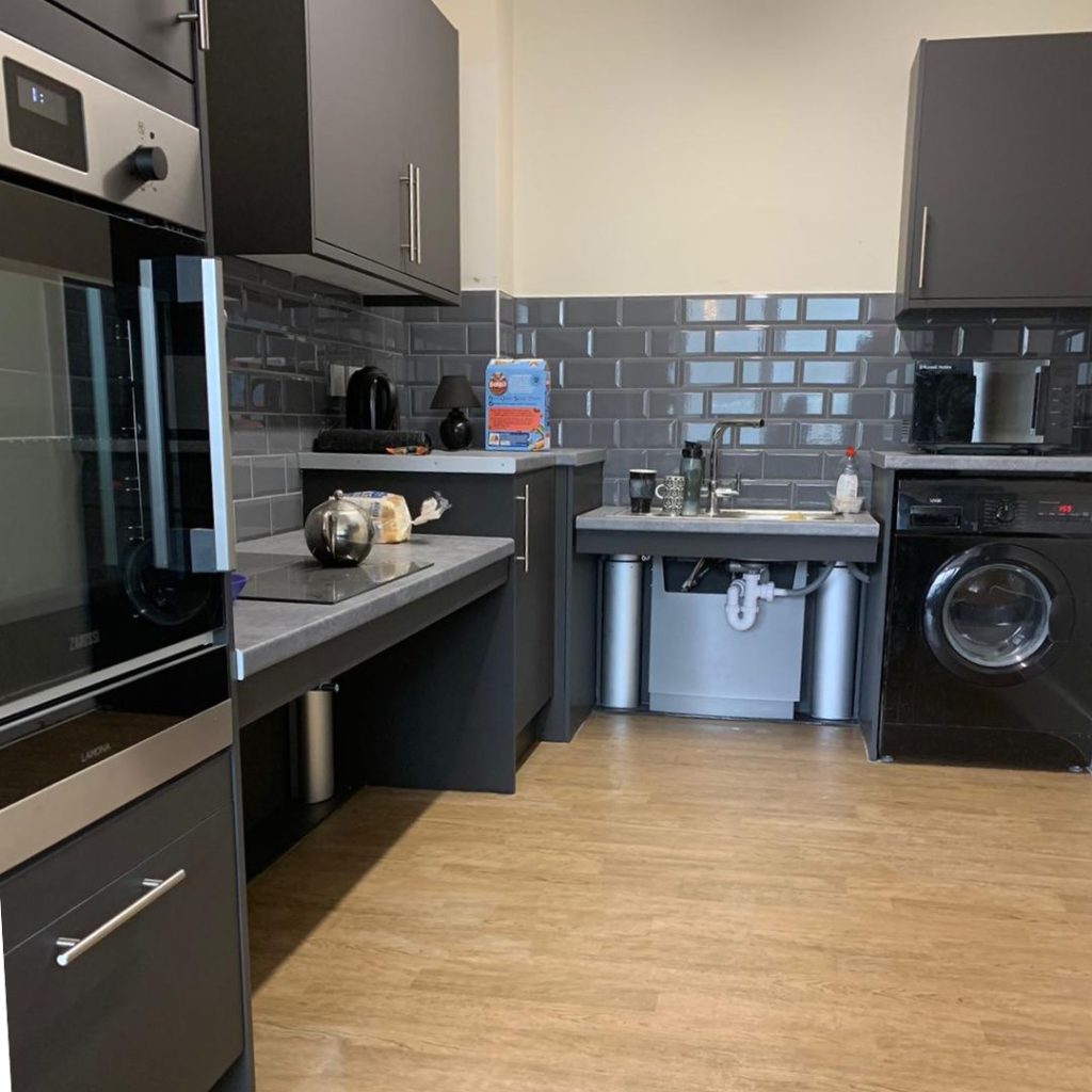 New kitchen with wheelchair accessible surfaces and sink